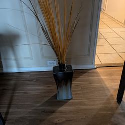 Ceramic Vase with decorative reeds coming from the top 