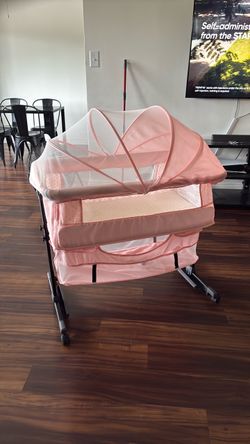 Pink Baby Bassinet with Canopy and Wheels
