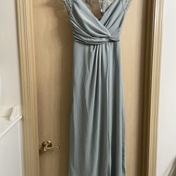 New with tags beautiful women’s size XS long gown with front slit. Sage green color 