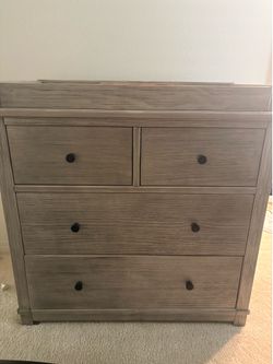 Light beige wooden dresser w/ changing area