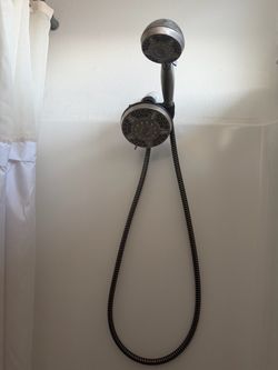 Shower head with hand held attachment