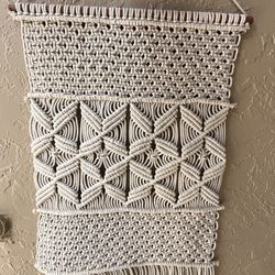 handmade cream macrame wall hanging with a boho geometric pattern