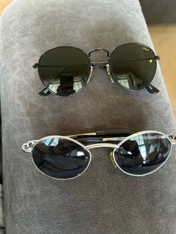 2 pair of round sunglasses