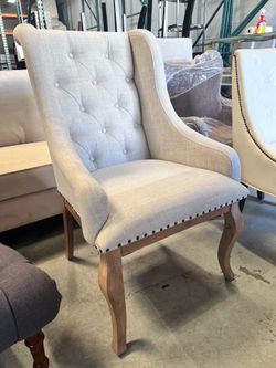 Cream tufted chair