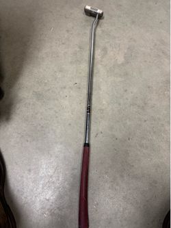 left-handed Odyssey White Steel #5 putter.