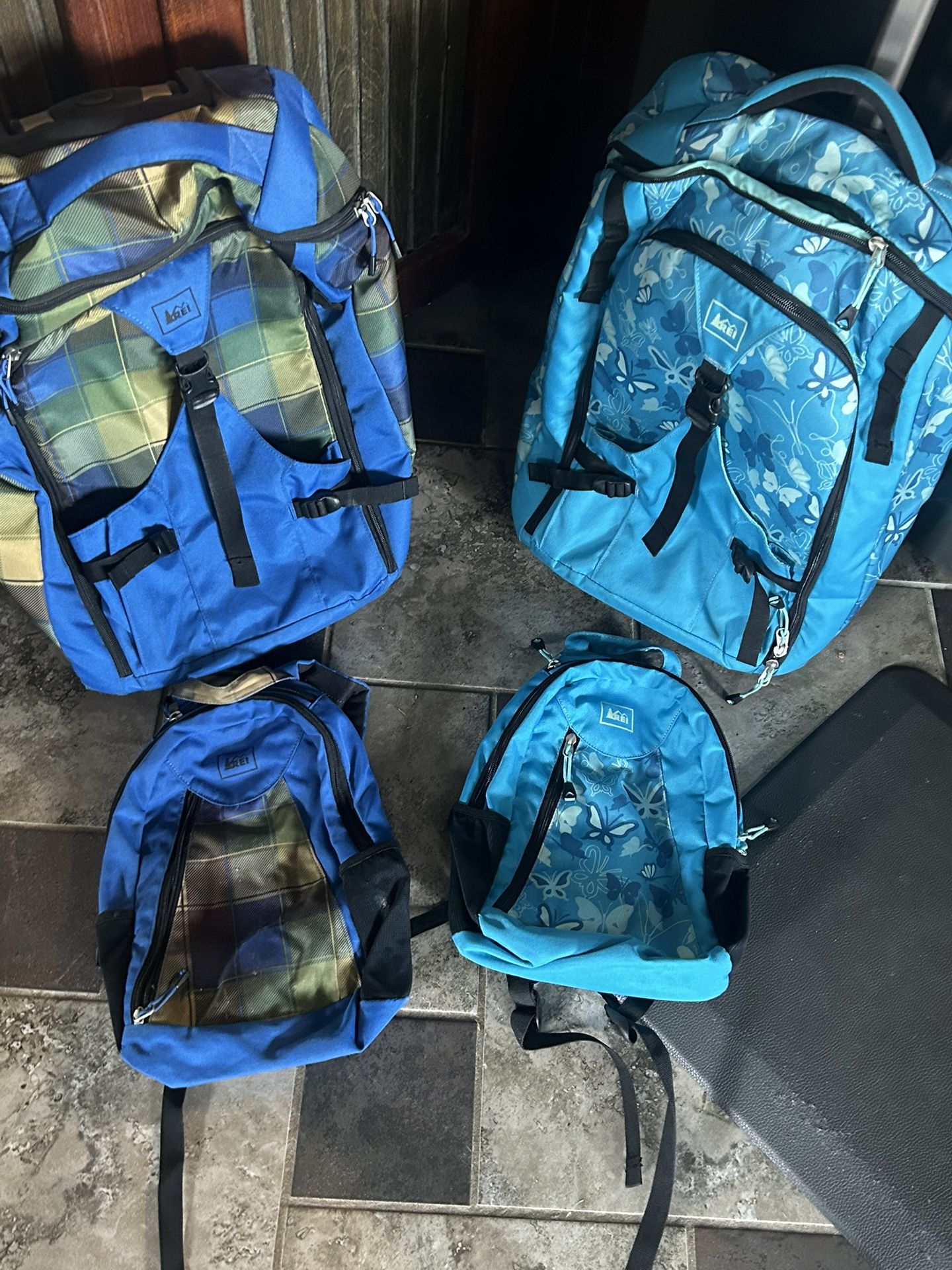 REI Matching Rolling Luggage With Kids Backpacks Set