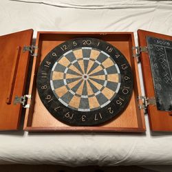 Dartboard Mounted in Wooden Cabinet