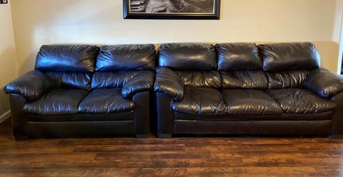 Dark brown leather couch and sectional