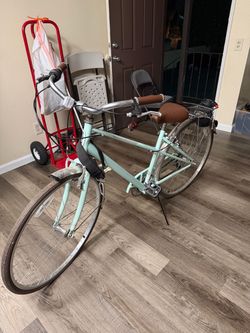 Schwinn, turquoise bicycle, 28 inch wheels