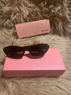 Black Miu Miu designer women’s sunglasses