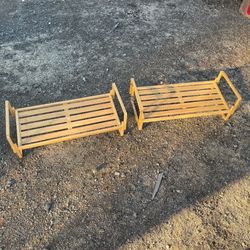 Two brown wooden shoe racks