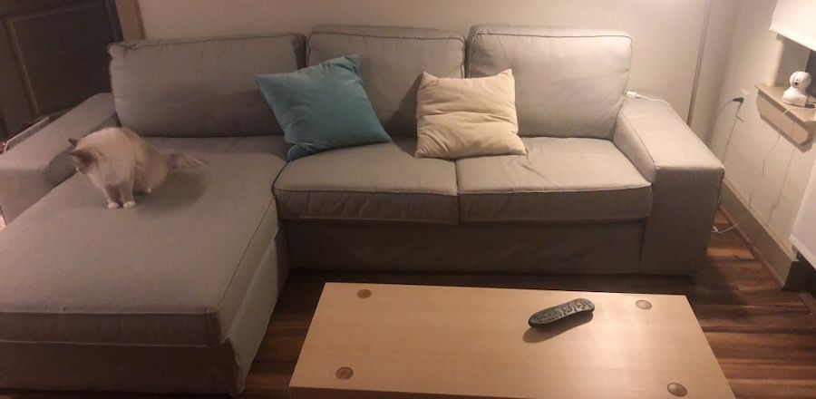 IKEA KIVIK Sectional with Coffee Table and throw pillows