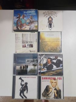 Lot of 8 Music CDs – Eagles, Jimmy Buffett, Samantha Fox, Bryan Adams, Eric Clapton