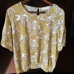 a Michael Kors women's blouse in a saffron yellow and white paisley print. 