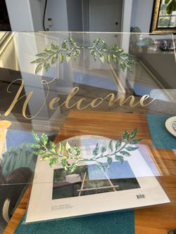An Acrylic  “WELCOME” Sign
