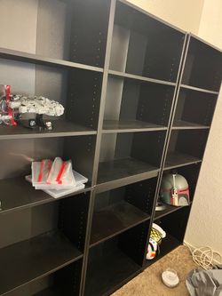 Three black bookcases