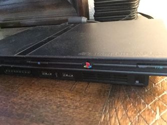 Ps2 with memory card 2 controller and 8 games