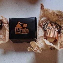 Two Tito's Handmade Vodka 25th Anniversary Metal Bottle Toppers