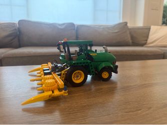 John Deer lego set, and Ninjago lego ship, and bin of random legos