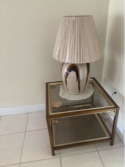 2 End tables Glass with brass trimming