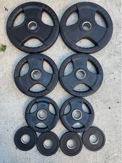 Olympic Weights 45s 25s 10s and four 1.25 kg nice quality workout weights