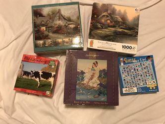 5 Boxes Of Jigsaw Puzzles