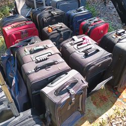 LOTS OF NICE PULL ALONG LUGGAGE 