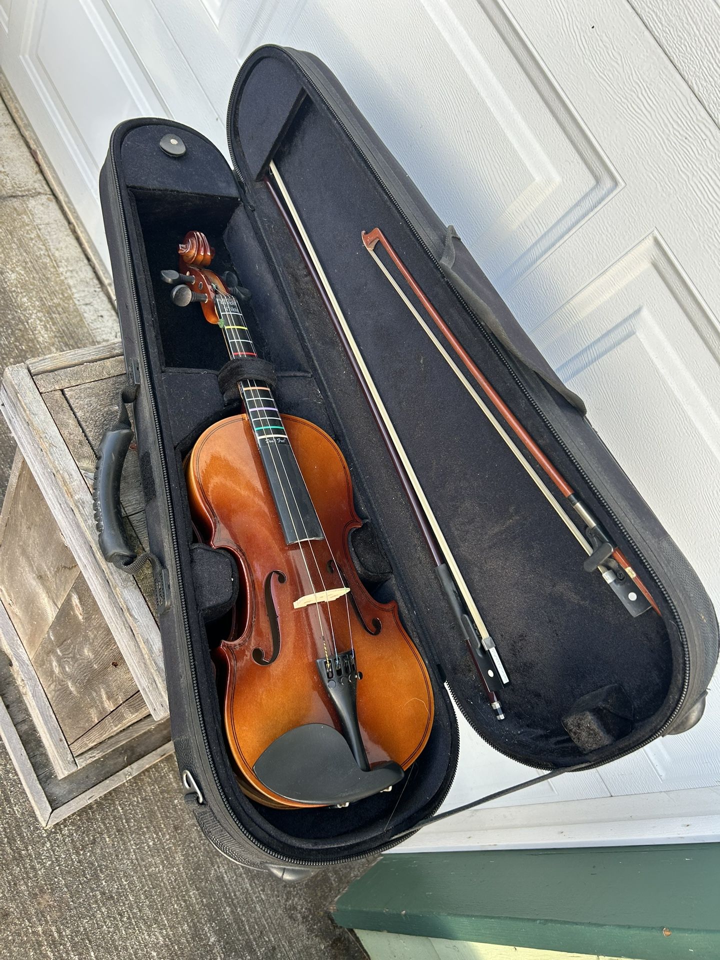 Student violin with case and two bows. Not sure of the brand as there’s no mark on the inside. Needs one string but seems to be in really good shape o