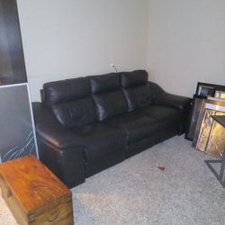 Black leather mechanical couch.