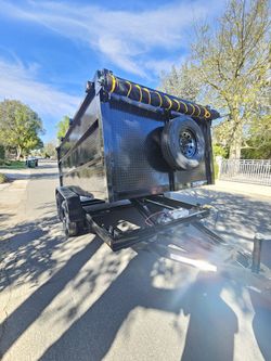 NEW DUMP TRAILER 12X8X4 12000 LBS
ROLLING TARP--SPARE TIRE,ELECTRIC BRAKES,HYDRAULIC SYSTEM,REMOTE CONTROL,IDEAL FOR HAULING, DEMOLITION, TRASH ETC,