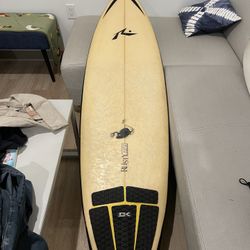 vintage rusty surfboard with custom paint on bottom
