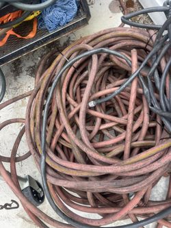 5 or 6 heavy duty garden hoses 100 ft and 50 ft. make offer