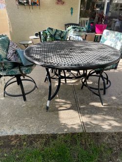 Iron patio table and 6 chairs