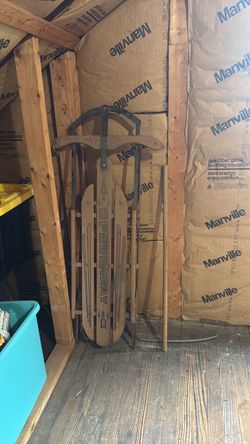 vintage wooden and metal snow sled