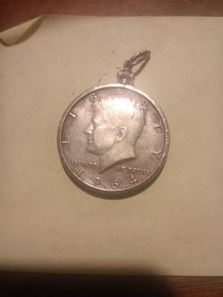 1964 Kennedy half dollar coin made into a pendant for sale.