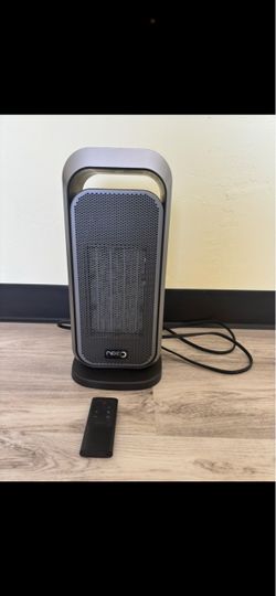 Dreo space heater with remote control. Works great and is in good condition. Features adjustable temperature, ECO mode, timer, and oscillation. Remote