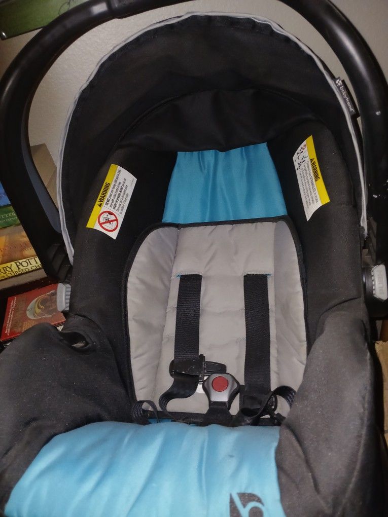 Two Car Seats And One Stroller