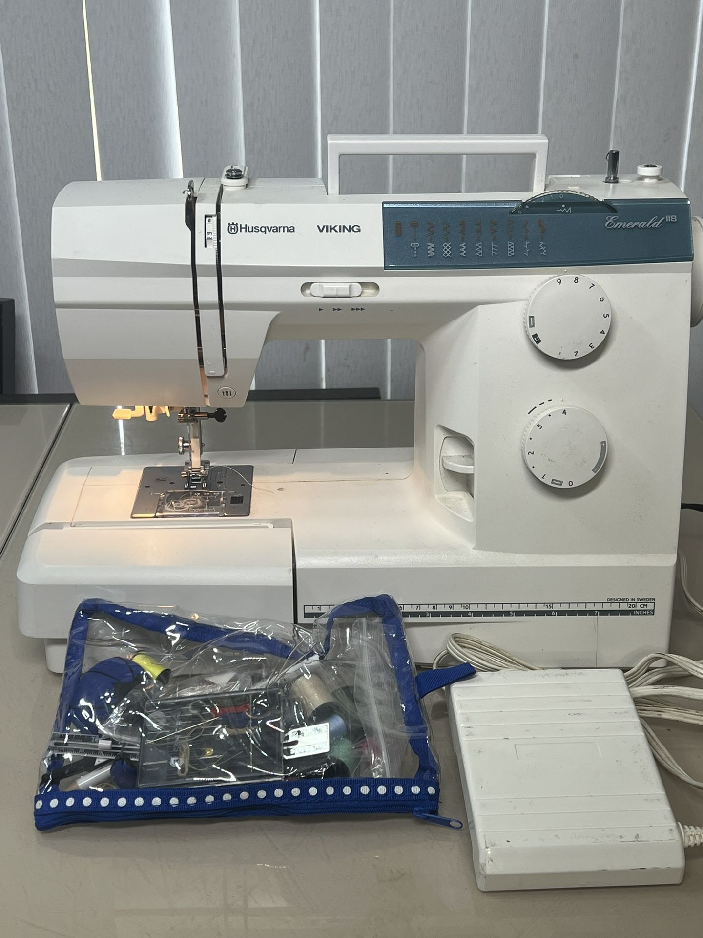 Husqvarna Viking Emerald 118 Sewing Machine Foot Pedal Power Cord Case DRY-TESTED. Used in good condition with some cosmetic blemishes. These blemishe
