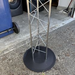 Round glass top dining table with modern truss base