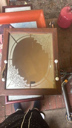 $35 glass mirror with coat hangers