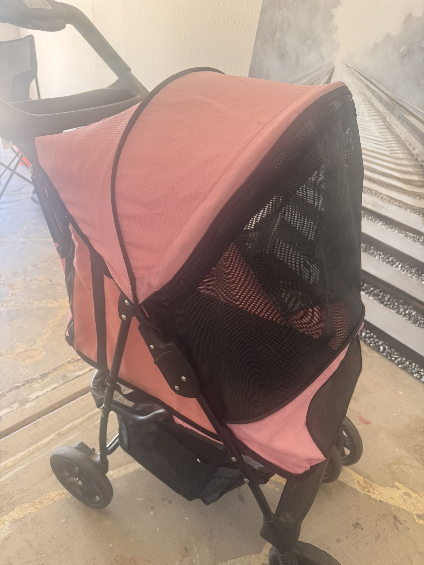 Pink dog stroller