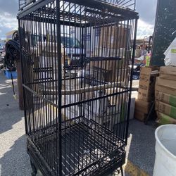 bird cage 6ft tall. Heavy duty quality made with casters. Excellent used condition Swap Shop Flea Market pick up or Delivery available. $150 firm Brow