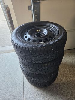 Like new Snow Tires w/rims. OBO