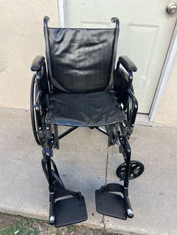 Black Folding Wheelchair with Footrests