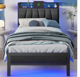Twin bed frame with led lights and charging stations.