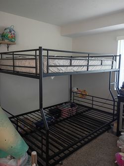 Full over queen bunk bed with twin size roll out bed at the bottom