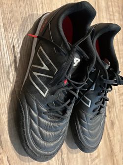 New Balance Black Soccer Cleats and shin guards