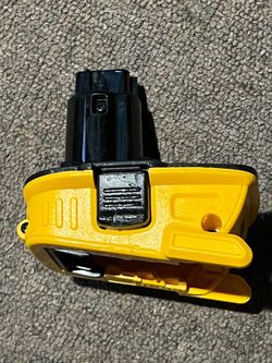 DEWALT DCA1820 battery adapter, which allows for conversion from 18V to 20V MAX. This device enables the use of DEWALT 20V MAX lithium-ion batteries (