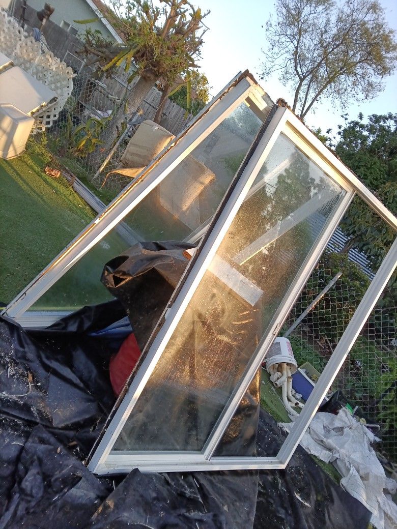 5 feet Wide 6 Feet Tall Double Pane Glass Vinyl Windows Both Have Complete Window But Both Need Screens