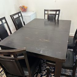 Dinner table with chairs